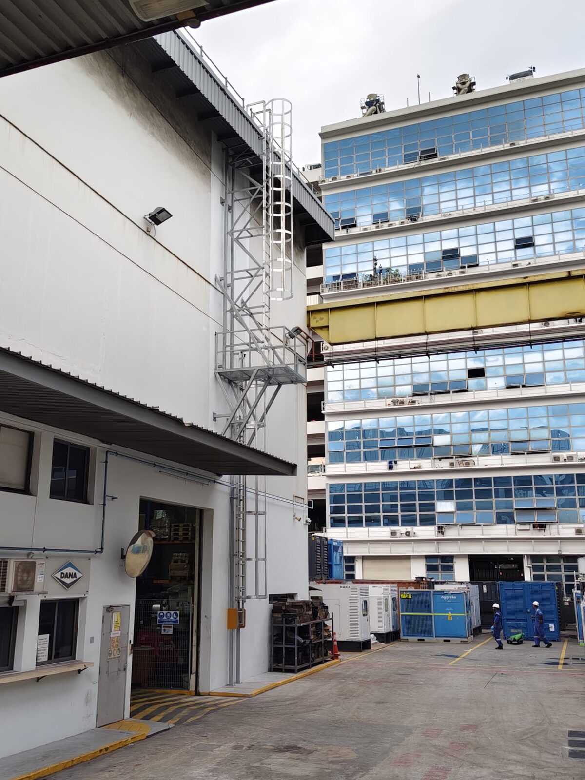 Buroh Street cat ladder with hoop guards and intermediate landing on a building elevation